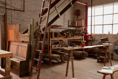 Shelves stacked with timber in the Zero Footprint Repurposing construction and demolition waste storage space