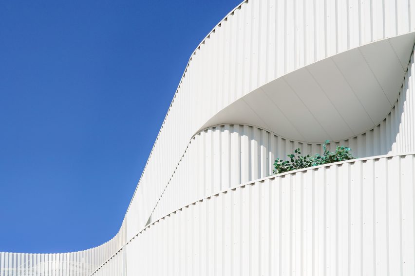curving metal apartment exterior