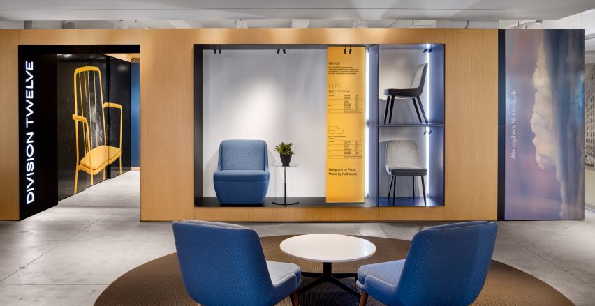 A photograph of Division Twelve's New York Showroom, with blue seating and a white table