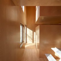 Jean Verville lines Montreal row house with sculptural plywood interiors