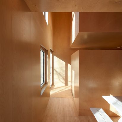 Jean Verville lines Montreal row house with sculptural plywood interiors