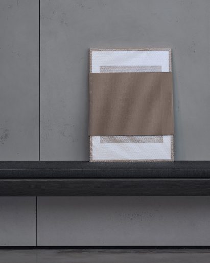 A piece of art leaning on a wall