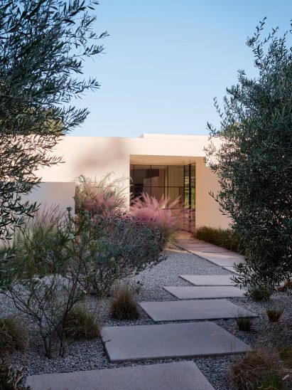 stucco home tucked in foilage