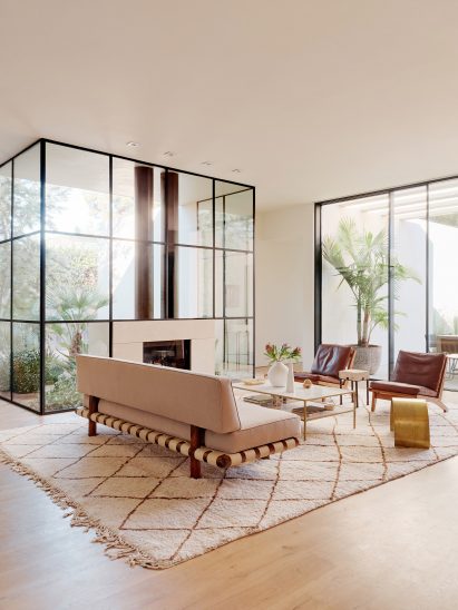 couches with rug and glass