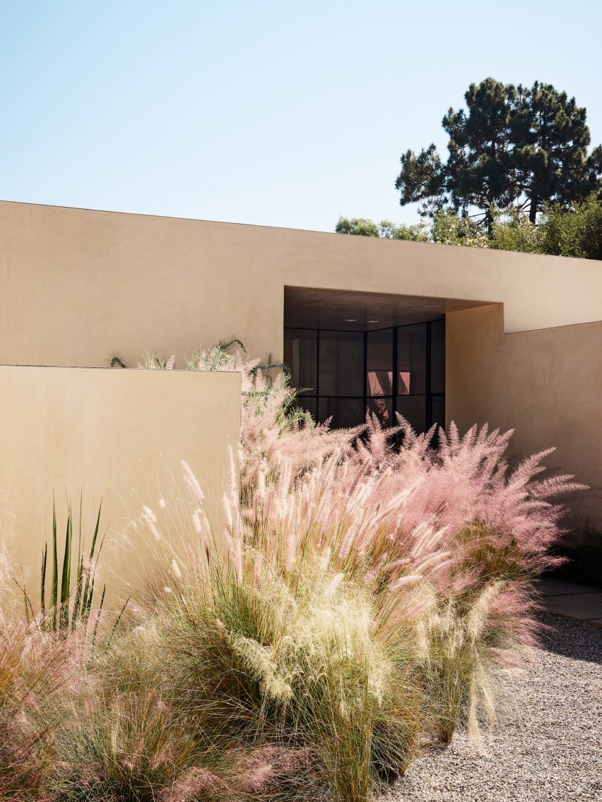 stucco and pink flowers