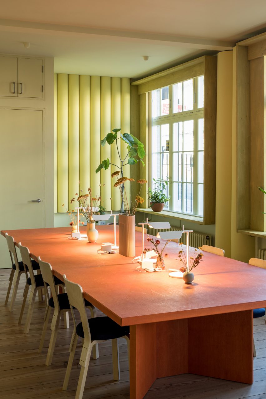 Red table in Bakken & Bæck office by Archmongers