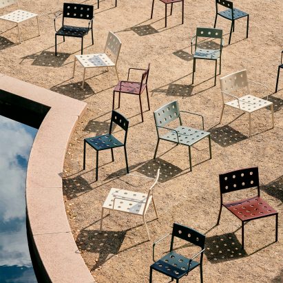 Multicoloured Balcony chairs by Hay on an outdoor area next to a pond