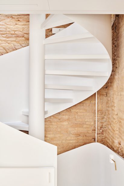 Spiral staircase features inside BSP20 House by Raúl Sánchez Architects