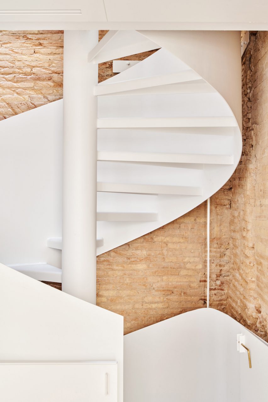 Spiral staircase features inside BSP20 House by Raúl Sánchez Architects