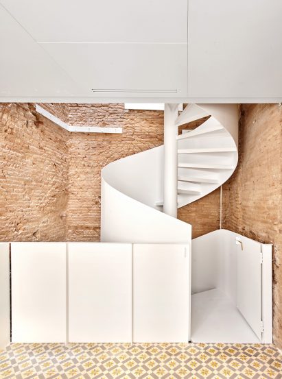 Spiral staircase features inside BSP20 House by Raúl Sánchez Architects