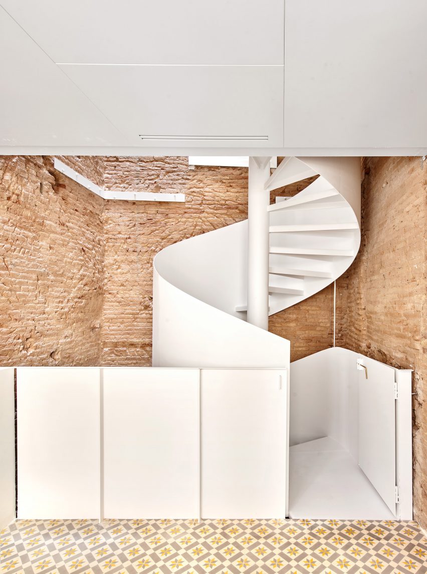 Spiral staircase features inside BSP20 House by Raúl Sánchez Architects