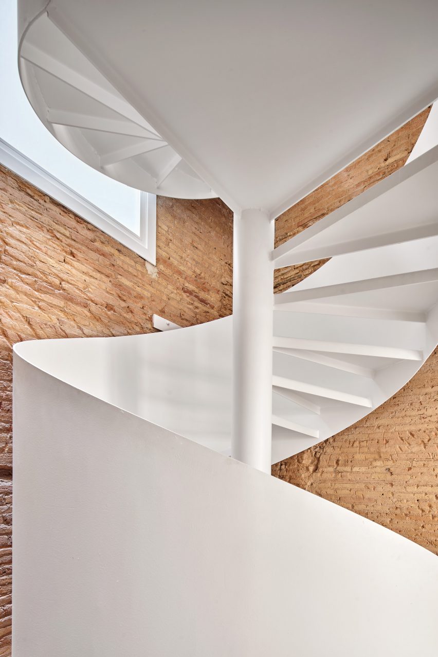Spiral staircase features inside BSP20 House by Raúl Sánchez Architects