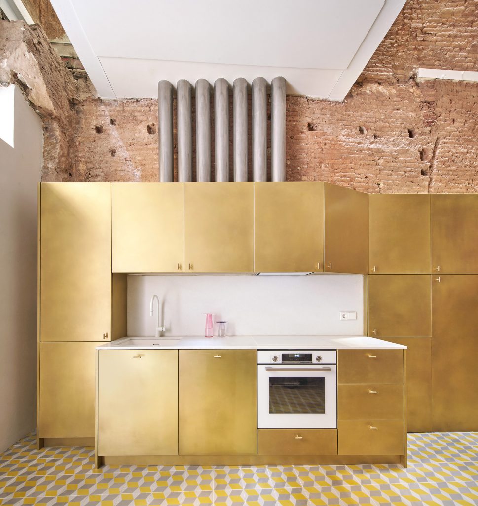 Brass kitchen features inside BSP20 House by Raúl Sánchez Architects