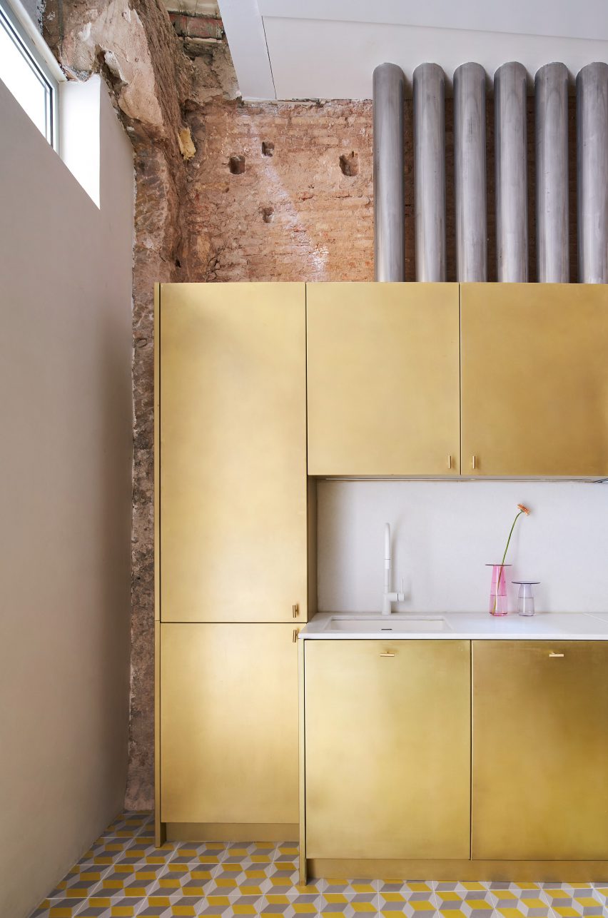 Brass kitchen features inside BSP20 House by Raúl Sánchez Architects