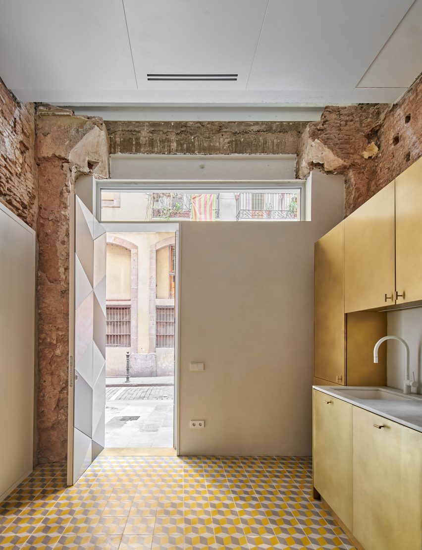 Brass kitchen features inside BSP20 House by Raúl Sánchez Architects