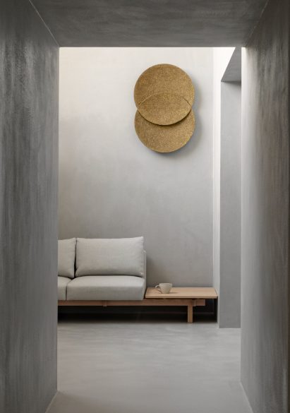 Circular artwork and sofa