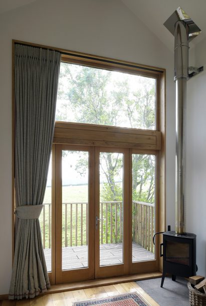 Glazed doors to wooden terrace