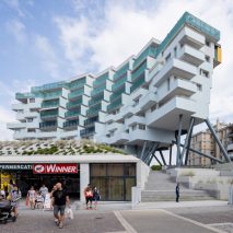 The Building Descending the Stairs pictured elevated above its surroundings