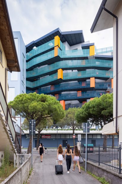 The Building Descending the Stairs pictured between a cluster of buildings