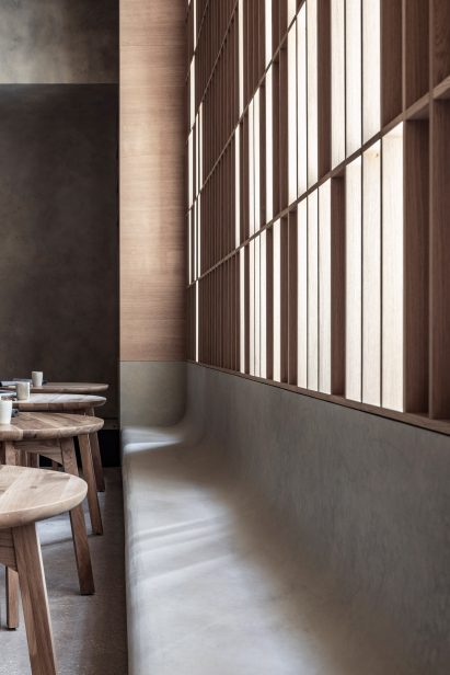 Built-in curved concrete bench seat in Hiba restaurant in Tel Aviv