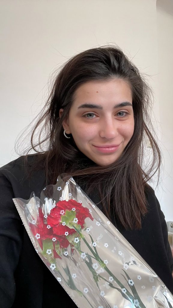 Katerina Kovalenko holding a rose