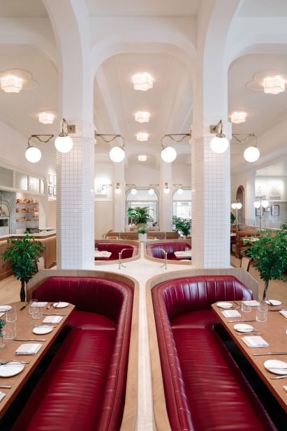 Leather banquettes between white columns