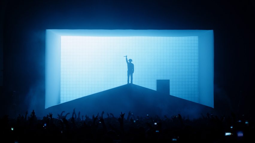 Slowthai performing on a house on stage