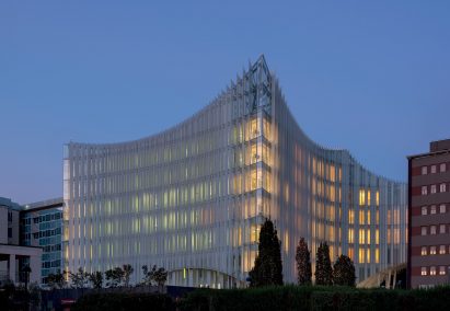 Image of the San Raffaele Hospital lit up a dusk