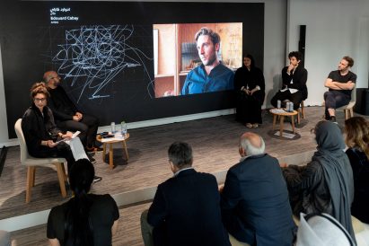 A photograph of a panel discussion 
