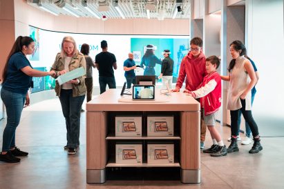 Customers trying products inside Meta Store