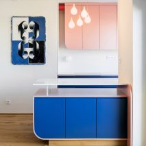 Kitchen counter detail with 69 painting visible on the wall to the left