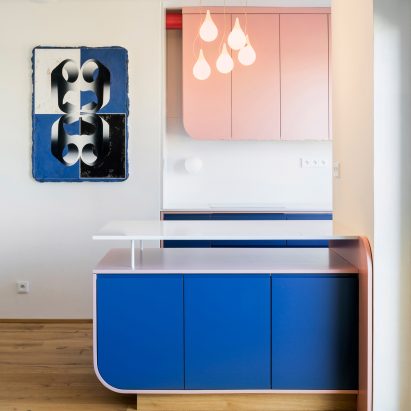 Kitchen counter detail with 69 painting visible on the wall to the left