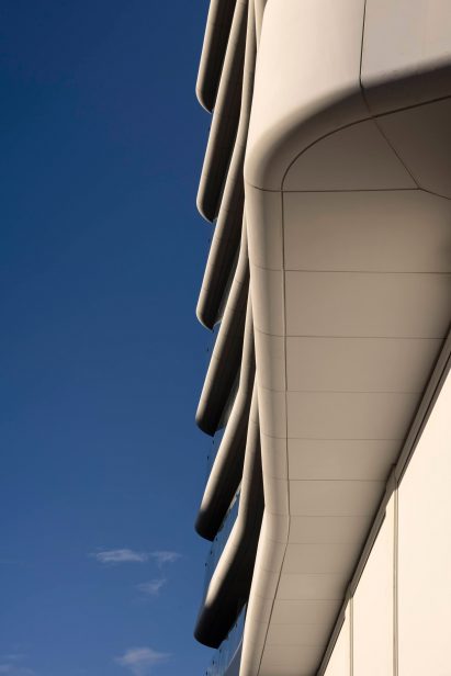 Image of the curving facade and balconies at the Antares Tower