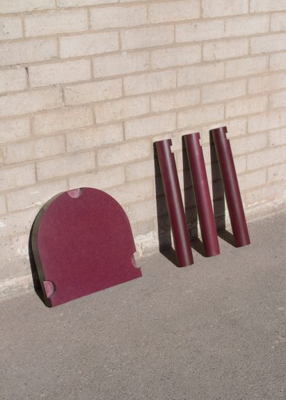 Components of stool by EBBA Architects leaning up against a wall