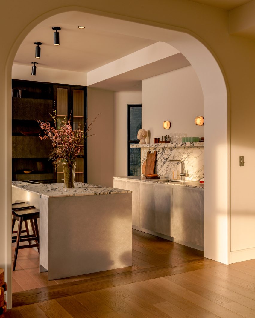 A kitchen with a stone island