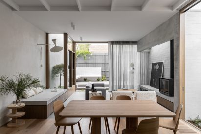 Living room interior of Ripponlea House by Luke Fry with window seat and grey couch