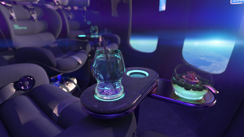 Rendering of glowing green cocktails sitting on the side table of a spacecraft lounge