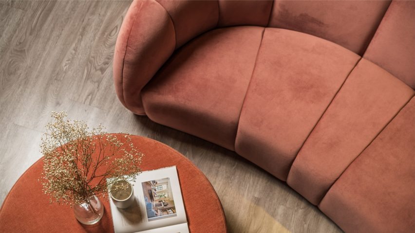 Orange Stax Recycled velvet by Texstyle used as upholstery on a curved sofa