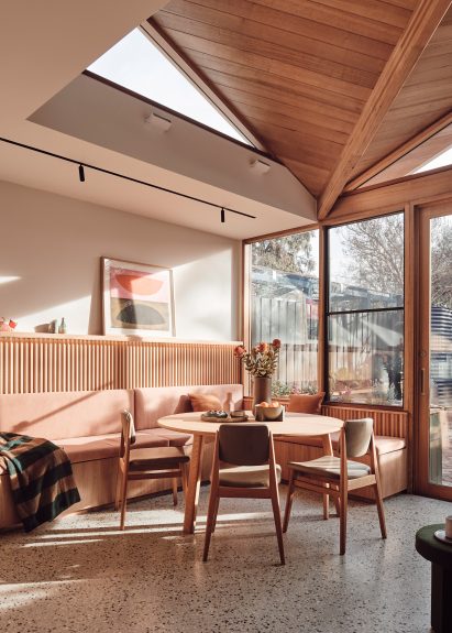 Built-in seating around the dining table in 10 Fold House, Australia, by Timmins + Whyte