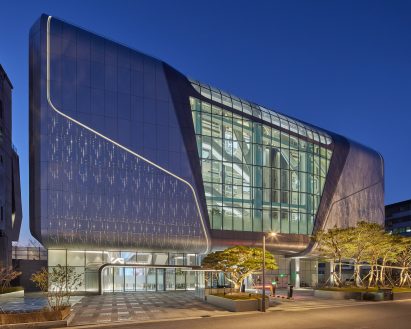 Metal and glass wraps around the exterior of YG HQ