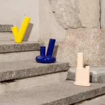 Three coloured bongs on steps