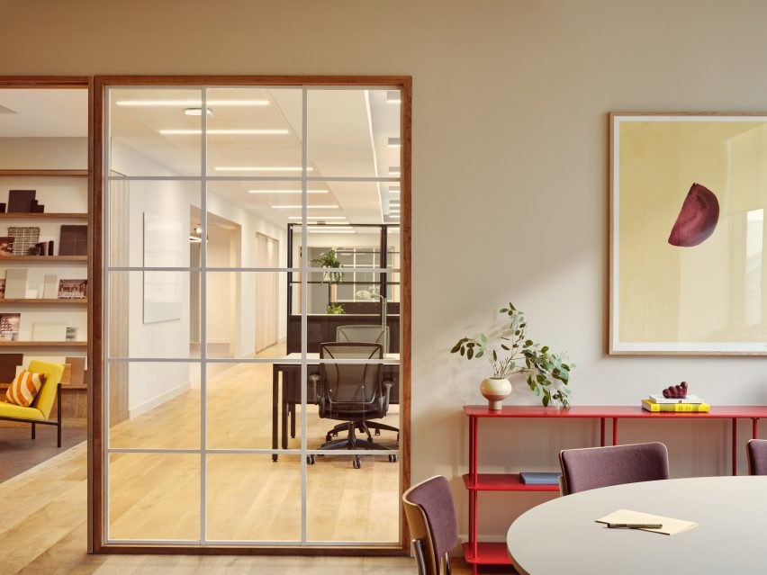 An office area with a yellow painting