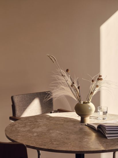 Vase with dried flowers on a table