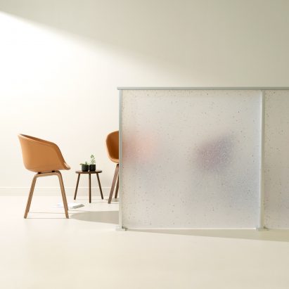 Flek Pure by 3form used as a partition wall with chairs behind