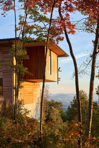 Cantilevered home with man looking out