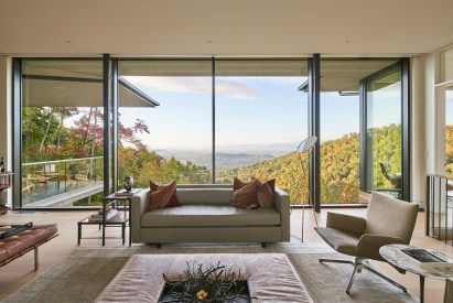 Living room with modern furniture overlooking Blue Ridge Mountains
