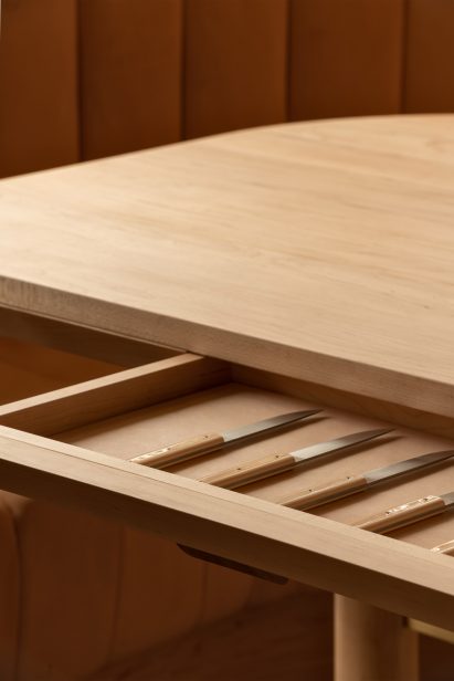 Wooden drawers in the tables