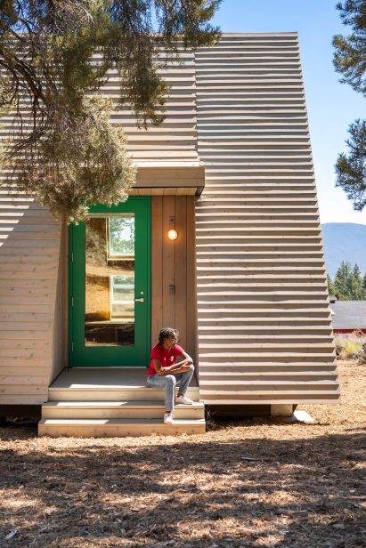 Camp Lakota bunk house with girl scout on steps