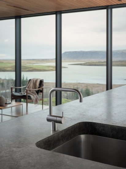 A photograph of Arborg House's kitchen sink, which is a Vola stainless steel product