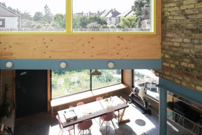 Image of the brick and wood-line interior of Forest House from the mezzanine level